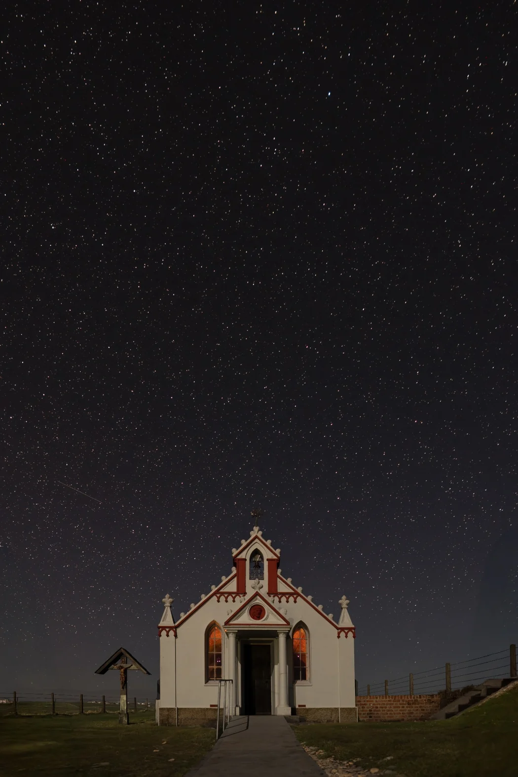 The Italian Chapel beneath a star-filled Orkney sky